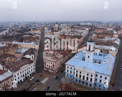 Aerial view of central part and City Hall of beautiful ancient ukrainian city Chernivtsi with its streets, old residential buildings, town hall Stock Photo