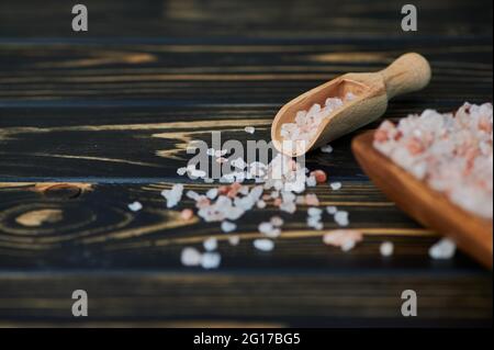 pink Himalayan salt on wooden background with copy space Stock Photo