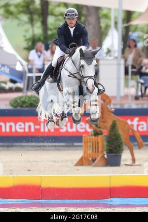 Balve, Germany. 05th June, 2021. Equestrian sport: German championship, show jumping. The show jumper Maximilian Lill rides D-Cassina at the German Show Jumping Championship. Credit: Friso Gentsch/dpa/Alamy Live News Stock Photo