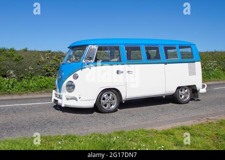 1967 60s sixties blue white Vw Volkswagen, quarter light windows,  split screen 1500cc petrol kombi, Caravans and Motorhomes, campervans on Britain's roads, RV leisure vehicle, family holidays, caravanette vacations, Touring caravan holiday, van conversions, Vanagon autohome, life on the road, ben-route to Capesthorne Hall classic May car show, Cheshire, UK Stock Photo