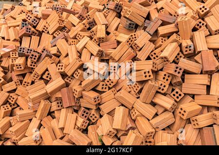 Building bricks with holes to make them lighter, Paksong, Laos Stock Photo