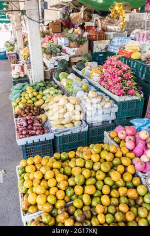 Oranges and fruit on sale at market shop, Pakse, Laos Stock Photo