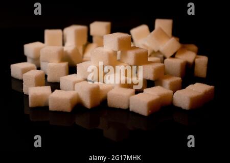 Sugar cubes in different arrangements and colored light. Arrows, Cubes, Pile, Square. Bavaria Germany Stock Photo