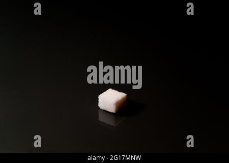Sugar cubes in different arrangements and colored light. Arrows, Cubes, Pile, Square. Bavaria Germany Stock Photo