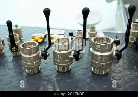 Ball valve placed on a counter. Plumbing. Stock Photo