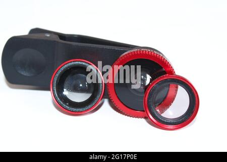 Phone lenses, mobile photography tools, different phone lenses isolated on white background. Stock Photo