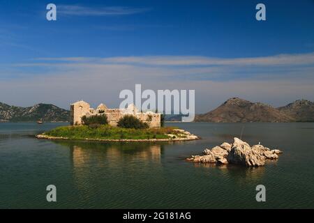 A close up view at Grmozur Fortress ruin, former prison at the island Grmozur in Lake Skadar National Park in Montenegro, famous tourist attraction. Stock Photo