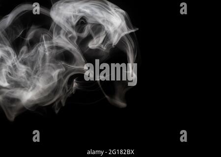 White smoke on black background Stock Photo