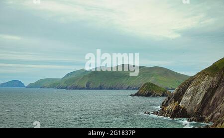 A view of Blasket Islands and Dunmore Head from Slea Head Drive. Slea Head Drive is a spectacular driving route that forming part of the Wild Atlantic Stock Photo