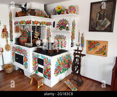 Zalipie, Poland. 05th Apr, 2021. Interior view of the Zalipie house. The village of Zalipie is known for its custom of hand-painted huts. The characteristic floral patterns can be found on most houses in the village. Credit: SOPA Images Limited/Alamy Live News Stock Photo