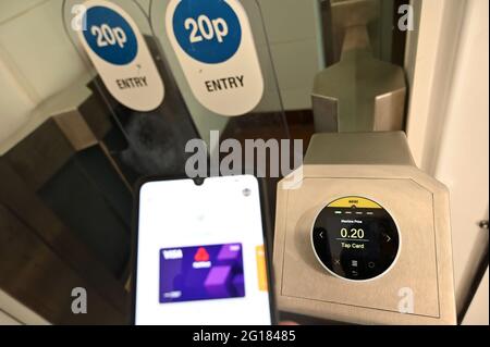 Contactless payment at a public toilet in south London. June 2021. Stock Photo