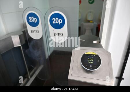 Contactless payment at a public toilet in south London. June 2021. Stock Photo