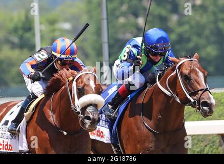 New York, United States. 05th June, 2021. Jackie's Warrior (left) ridden by Joel Rosario, comes from the outside to beat Drain the Clock, Irad Ortiz, Jr. up, to win the Woody Stephens, the 3rd race prior to the 153rd running of the Belmont Stakes at Belmont Park, NY. June 4, 2021 Photo by Mark Abraham/UPI Credit: UPI/Alamy Live News Stock Photo