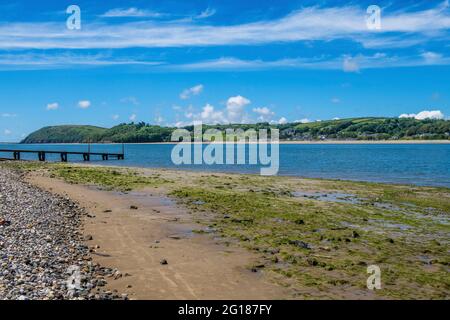 The view from Ferryside across the River (Afon) Tywi estuary in Carmarthenshire on the coast on a sunny June day in south Wales Stock Photo