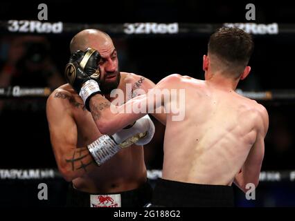 Stefan Slachev (left) and Liam Davies in the Bantamweight contest during the Boxing event at the Telford International Centre, Telford. Picture date: Saturday June 5, 2021. Stock Photo