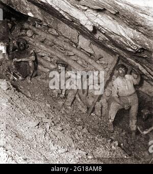 Workers in inclined section of mine with props, City & Suburban Gold Mine, Johannesburg, South Africa Stock Photo