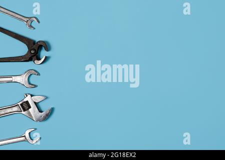 Happy father's day banner with copy space. Man or husband concept. Different wrenches on blue background. Happy labor day. Stock Photo