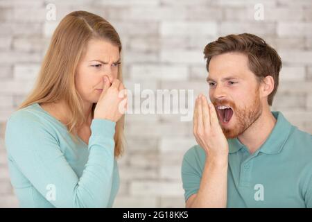 female disgusted by boyfriend breath Stock Photo