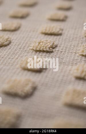 Close up of some yellow woven squares with wool texture Stock Photo