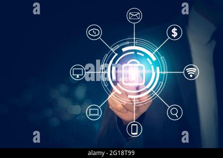 Hand of businessman pushing icon lock sign while cyber security with access with finger, data and privacy with protection digital virtual, innovation Stock Photo