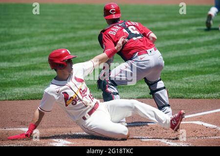 St. Louis Cardinals Tommy Edman slides safely past Cincinnati Reds catcher Tucker Barnhart to score from second base on a single by Nolan Arenado in the first inning at Busch Stadium in St. Louis on Saturday, June 5, 2021. Photo by Bill Greenblatt/UPI Stock Photo