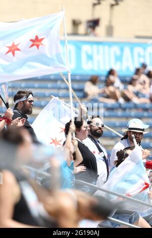 Chicago Red Stars fans waving flags during a NWSL match against the North Carolina Courage at SeatGeek Stadium, Saturday, June 5, 2021, in Bridgeview, Stock Photo