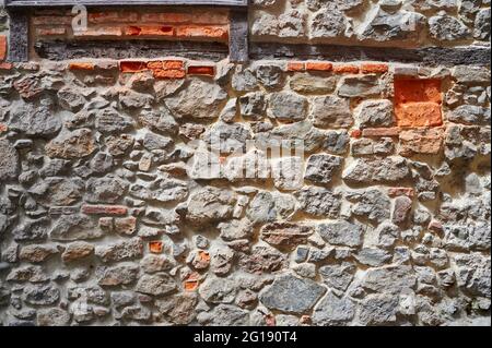 Detail of the ancient stone and bricks wall Stock Photo