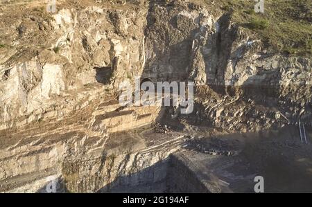 Entrance of tunnel in rock aerial drone view on sunny day