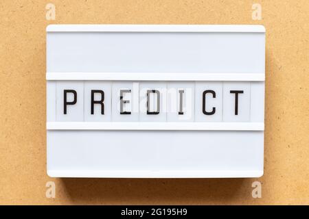 Lightbox with word predict on wood background Stock Photo
