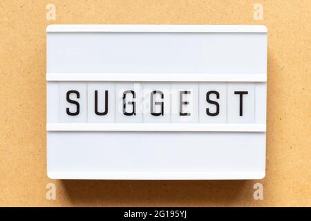 Lightbox with word suggest on wood background Stock Photo