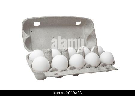 Several White and one brown eggs in a basket. Rural scene. Easter background - fresh chicken eggs. Concept is not like everyone else. Stock Photo