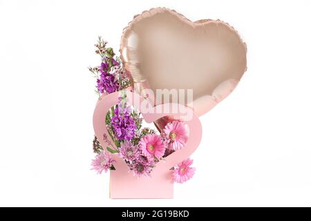 Flower bouquet with balloon and place for text. Stock Photo
