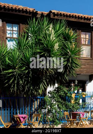 Close up view of traditional, old, wooden house and flowers in famous Aegean town called 'Sigacik'. It is a village of Seferihisar district of Izmir / Stock Photo