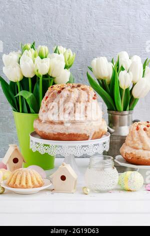 Easter table with cakes, eggs and flowers. Festive breakfast Stock Photo