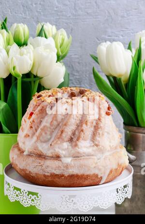Easter table with cakes, eggs and flowers. Festive breakfast Stock Photo
