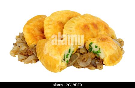 Group of potato and cheese filled Pierogi dumplings with fried onions isolated on a white background Stock Photo
