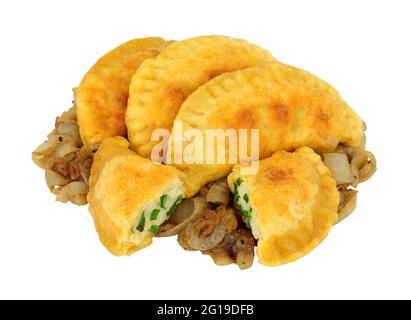 Group of potato and cheese filled Pierogi dumplings with fried onions isolated on a white background Stock Photo