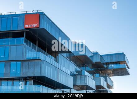 Exterior view of the Bridge building, housing the new headquarters of Orange, a French telecommunications company Stock Photo