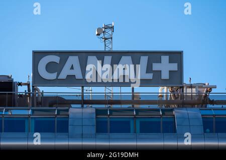 Sign at the top of the Canal+ building. Canal+ is a private French national pay-per-view television channel focused on cinema and sport Stock Photo