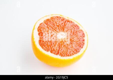 Fresh red grapefruit half cut isolated on white background Stock Photo