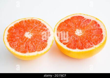 Fresh red cutted grapefruit isolated on white background Stock Photo