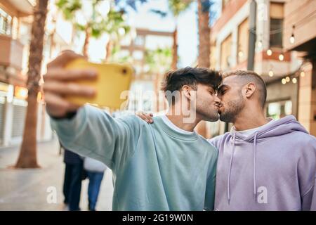 POV Shot Of Same Sex Female Couple Kissing Pose For Selfie As They Visit  Oxford UK Together Stock Photo by monkeybusiness