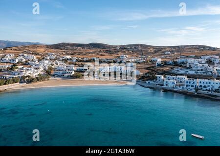 Greece, Koufonisi island, small Cyclades. Aerial drone view. Pano Koufonisi white traditional village buildings, Megali Ammos sandy beach. Calm turqui Stock Photo