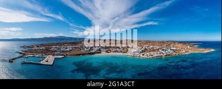 Greece, Koufonisi island, small Cyclades. Aerial drone panoramic view. Pano Koufonisi panorama white traditional village buildings, sandy beach, port Stock Photo