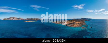 Greece, Koufonisia, small Cyclades islands. Aerial drone panoramic view. Kato Koufonisi and Keros Rippled sea water, blue sky background. Stock Photo