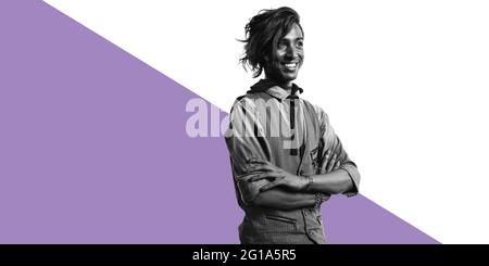 Happy african man in coat isolated on dual tone background. Smiling man standing with arms crossed and looking away. Stock Photo