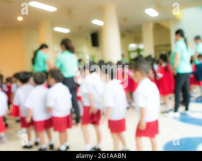 The blurred ambiance of teachers and kindergarten students to use as a background image Stock Photo