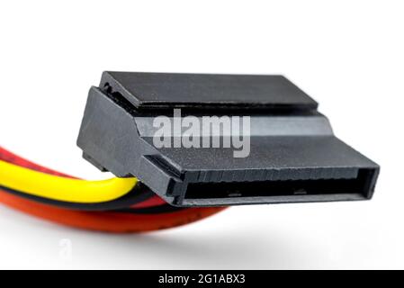 A 15 contacts serial ATA plug for powering a hard disk or CD drive coming from a computer power supply, isolated on a white background. Stock Photo