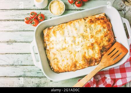 Traditional italian lasagna with vegetables, minced meat and cheese. On a wooden background. Top view, copy space Stock Photo