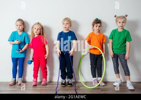 Young children adore doing physical activities at preschool Stock Photo